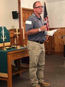 Coach Pete Hedgepath, a member of Saloma Baptist Church, speaks to the congregation about the Bass Fishing Team. 