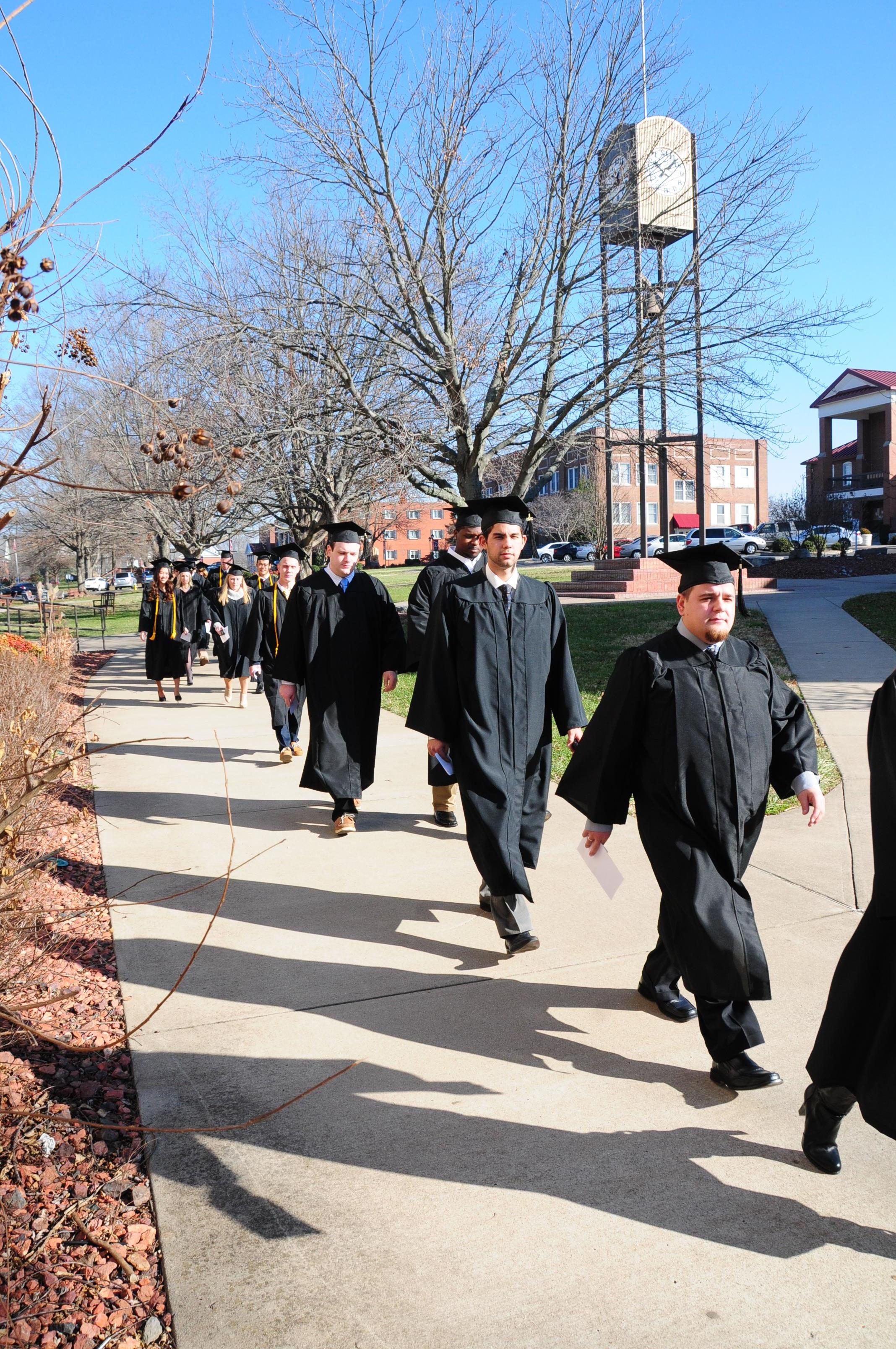  Graduates performing the ceremonial walk around  campus. (Campbellsville University Photo by Kyle  Perkins)