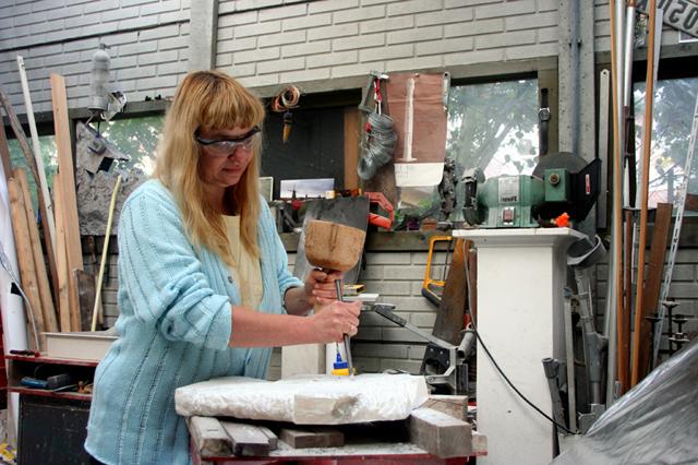 Lina Hodoroabă, sister of Sida Roberts, works on her art. From Holland, she will have a display of  her work at the Pence-Chowning Art Gallery Nov. 18-26.