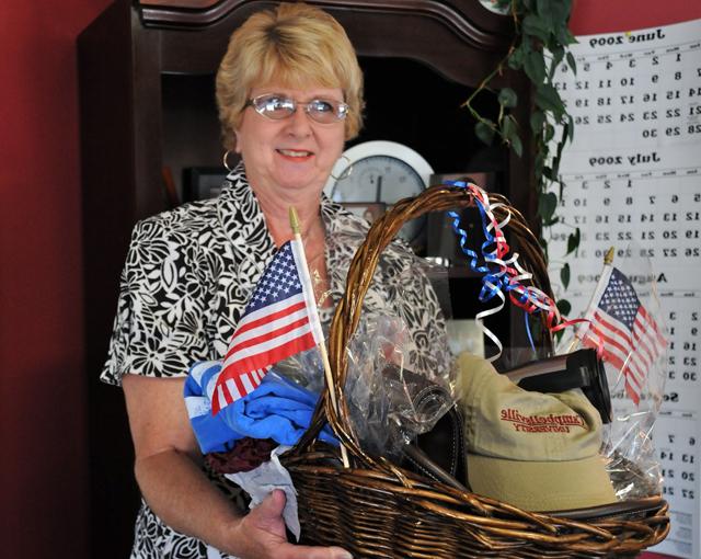 The winner of Campbellsville University's July 4th prize gift basket was Linda Beal from Casey Creek, Ky. She is a graduate of Taylor county High School and a 1966 alumna of CU. Beal said she was very excited to have won and it had come as a complete surprise. "I just stopped by the booth for directions," she said, "and Emma Revis told me to put my name in the box!" (CU photo by Linda Waggener)