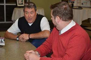 Eric Graves, right, a graduate of the master of arts in special education program at CU, talks with the board of examiners, as Matt Peyton, current MASE student, listens. (Campbellsville University Photo by Joan C. McKinney)